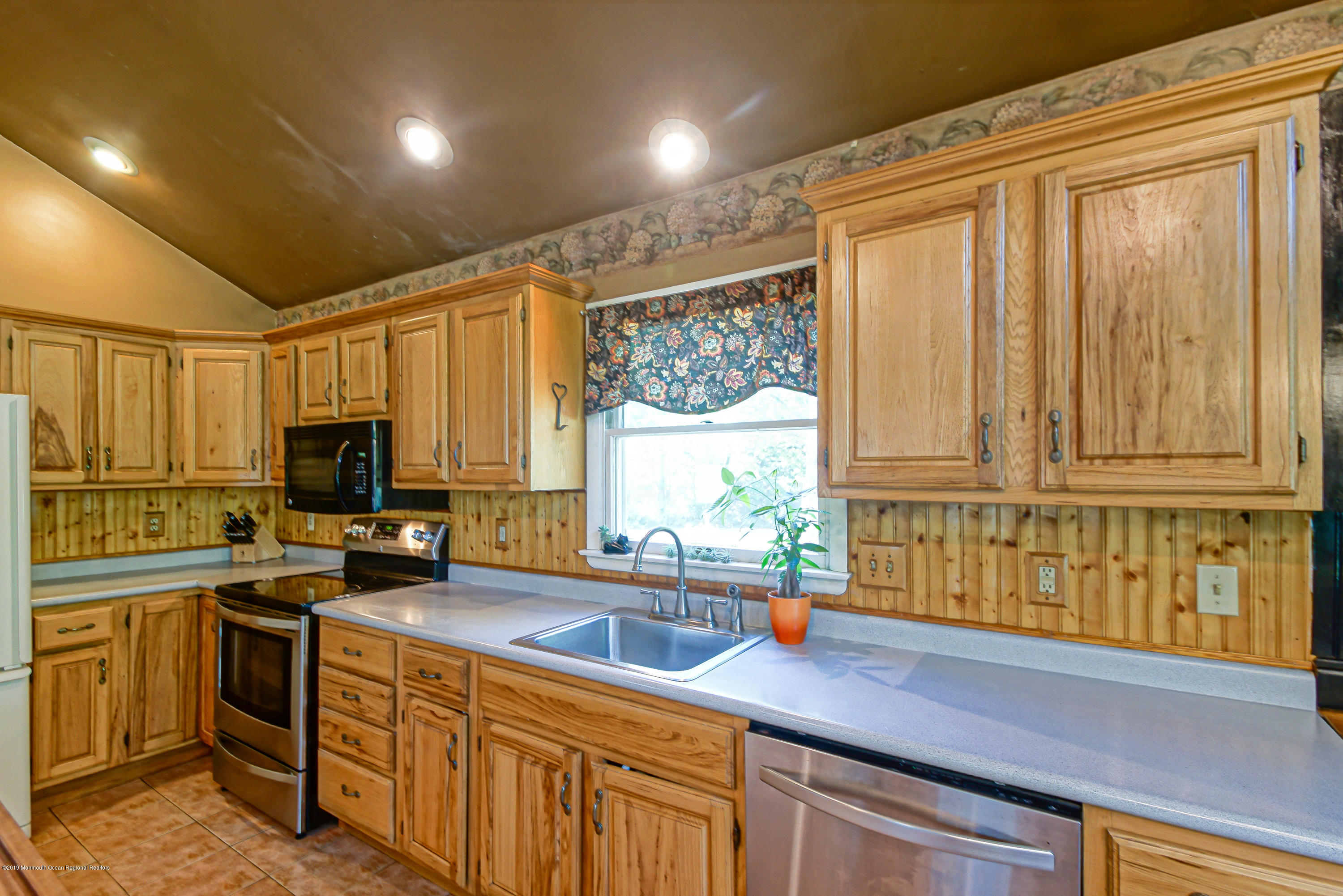 382 Cherry Quay Road, Unit A Brick, NJ 08723 - Photo 14 of 33 a kitchen that has a sink and a stove in it