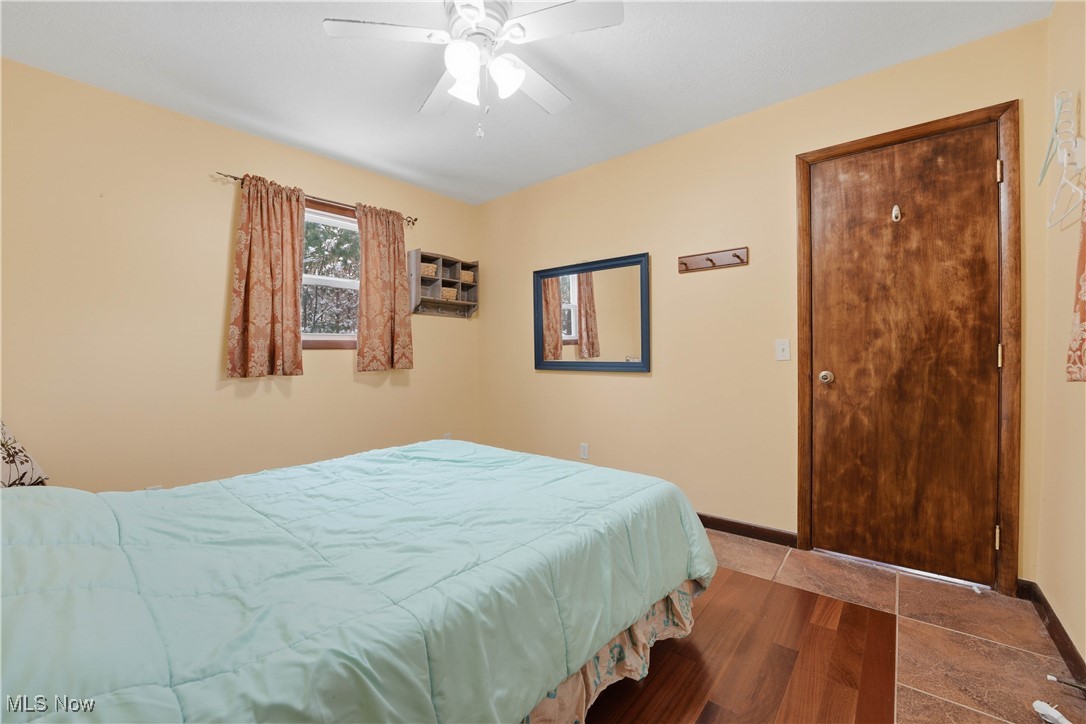4254 Doral Road Southwest Carrollton, OH 44615 - Photo 29 of 46 Bedroom featuring baseboards and ceiling fan