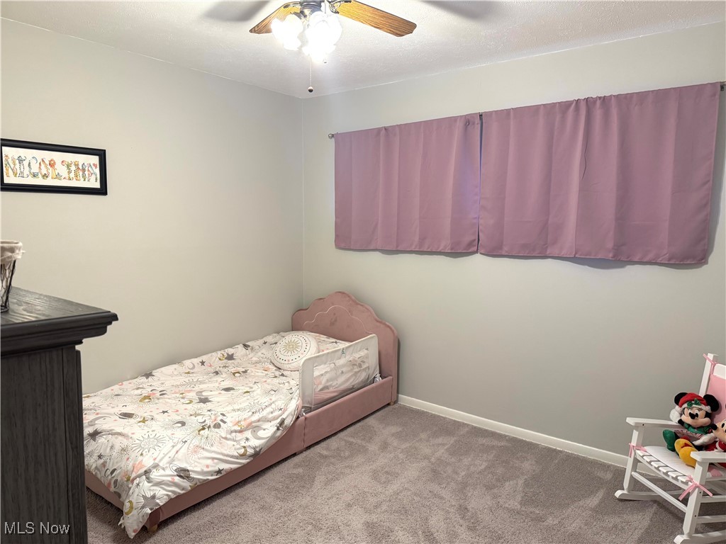975 Som Center Road Cleveland, OH 44143 - Photo 16 of 18 Bedroom with carpet flooring and ceiling fan