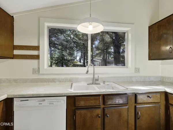 a sink a mirror and window