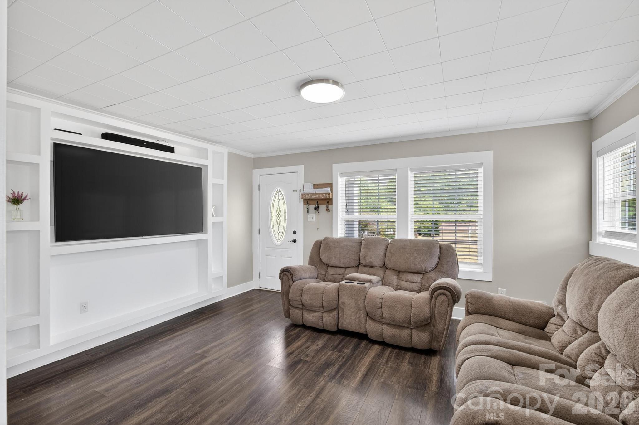 2076 Connelly Springs Road Lenoir, NC 28645 - Photo 7 of 47 a living room with furniture and a flat screen tv