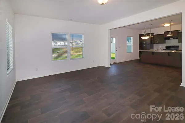 a view of a kitchen with a sink and a window