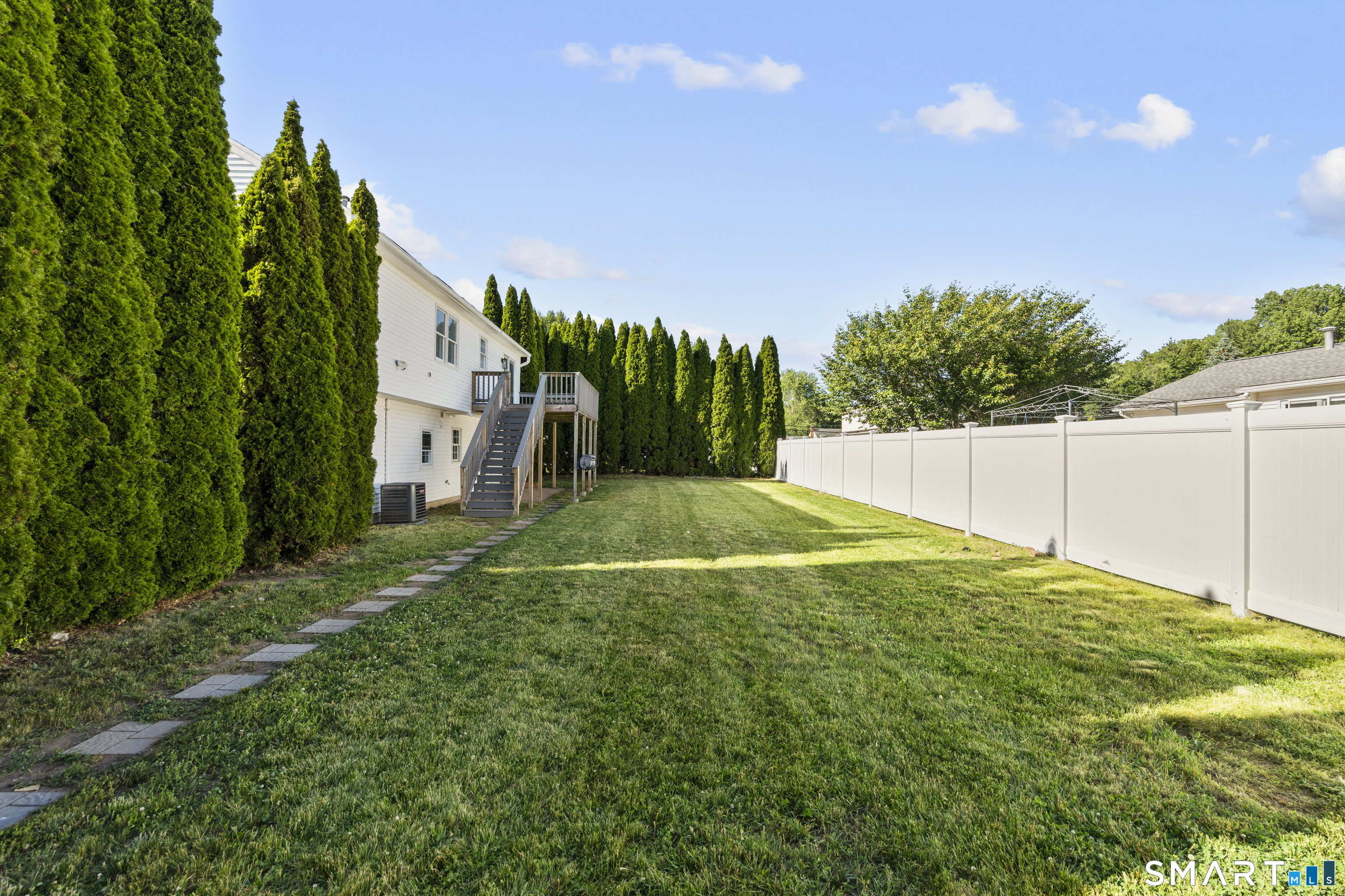 39 Joseph Lane Hamden, CT 06514 - Photo 10 of 40 a backyard of a house with lots of green space