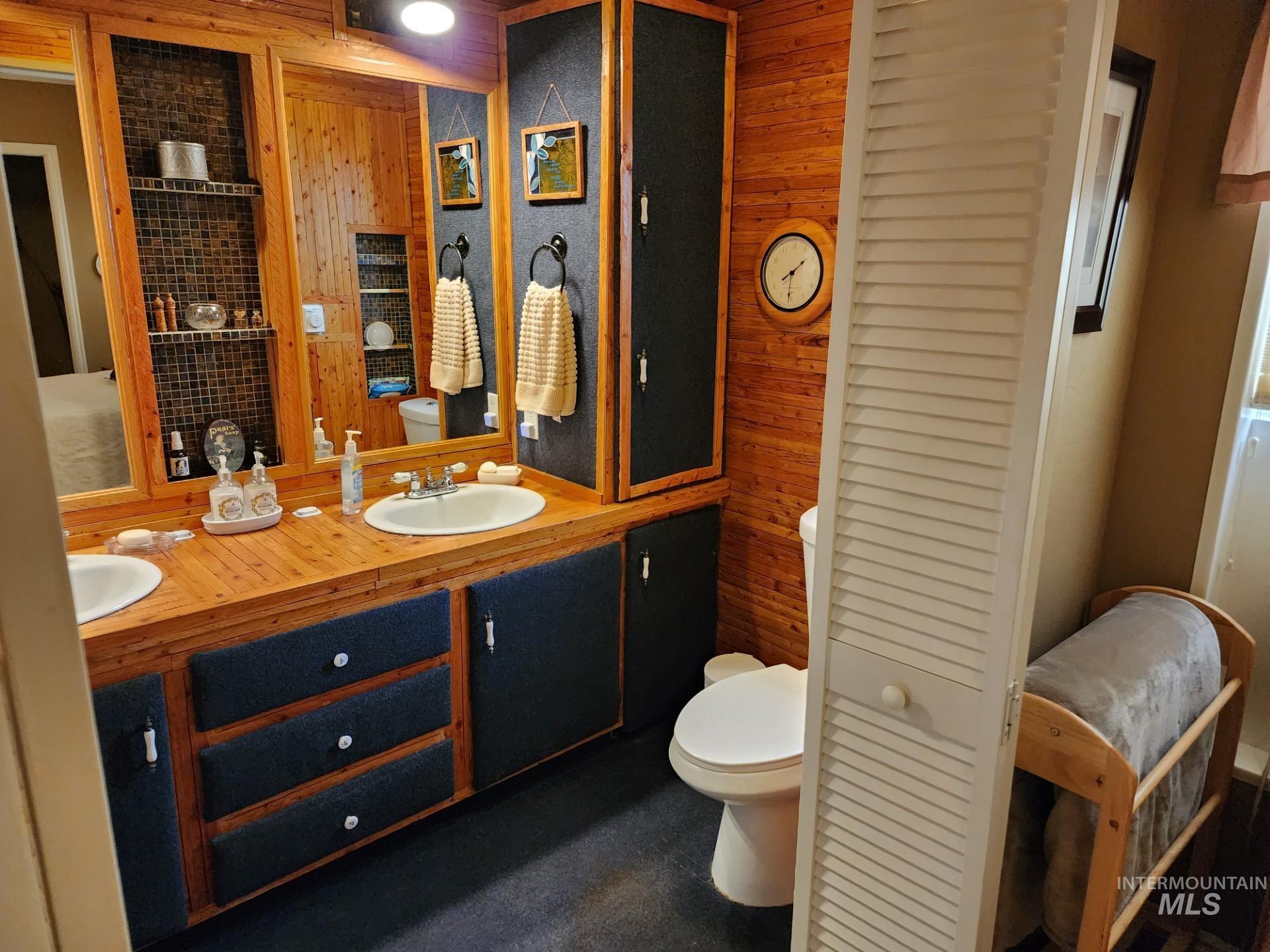 235 5th Street Grand View, ID 83624 - Photo 17 of 22 Bathroom featuring a dual vanity with integrated sinks and wood-finish countertop