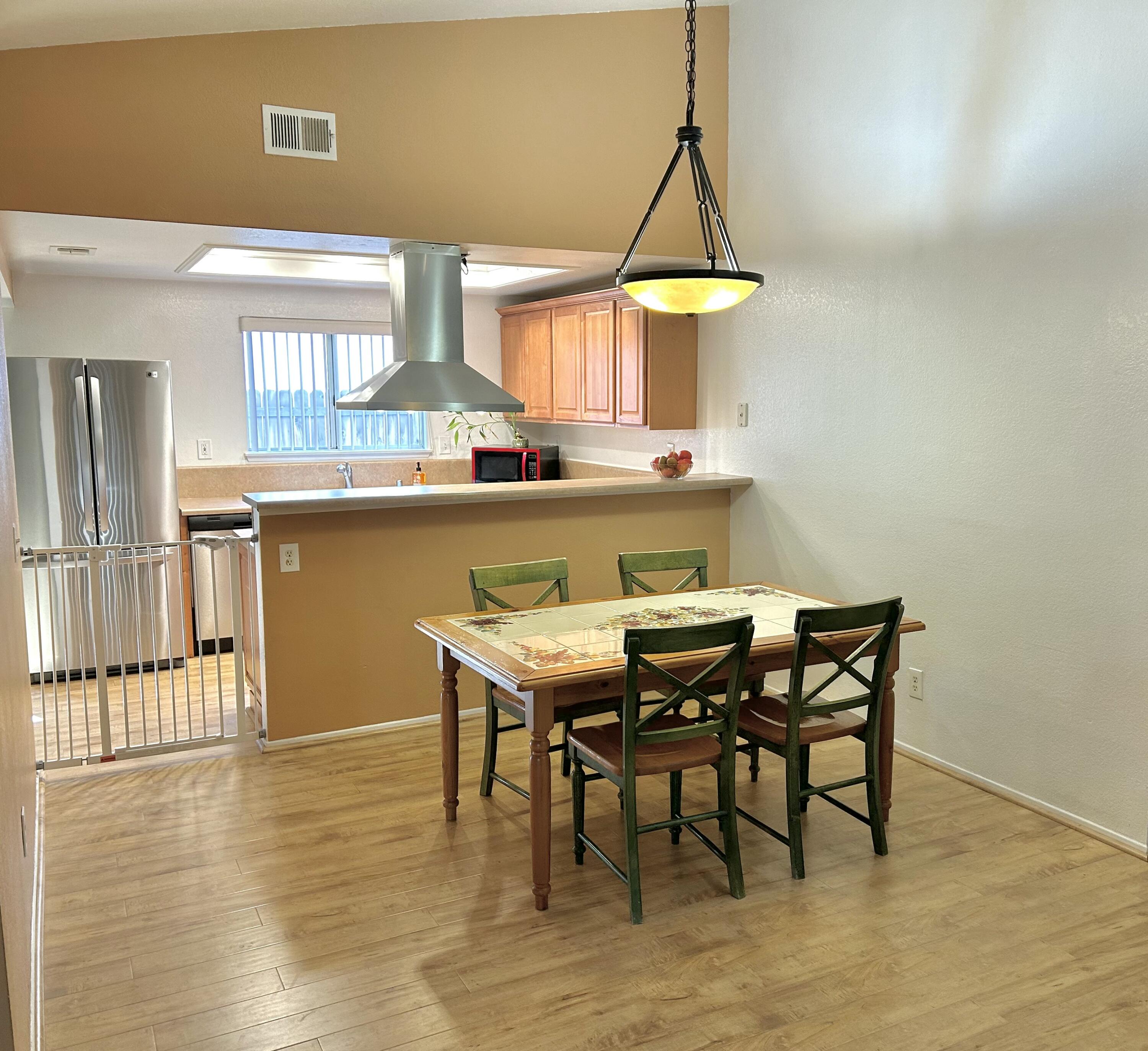 19940 Promenade Circle Riverside, CA 92508 - Photo 11 of 33 a view of a dining room with furniture and wooden floor