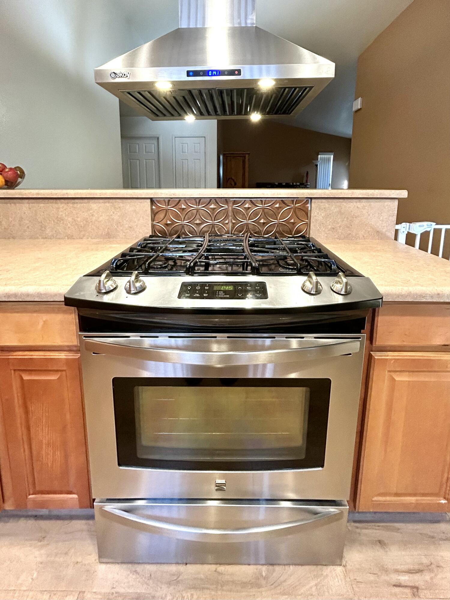 19940 Promenade Circle Riverside, CA 92508 - Photo 13 of 33 a stove top oven sitting inside of a kitchen