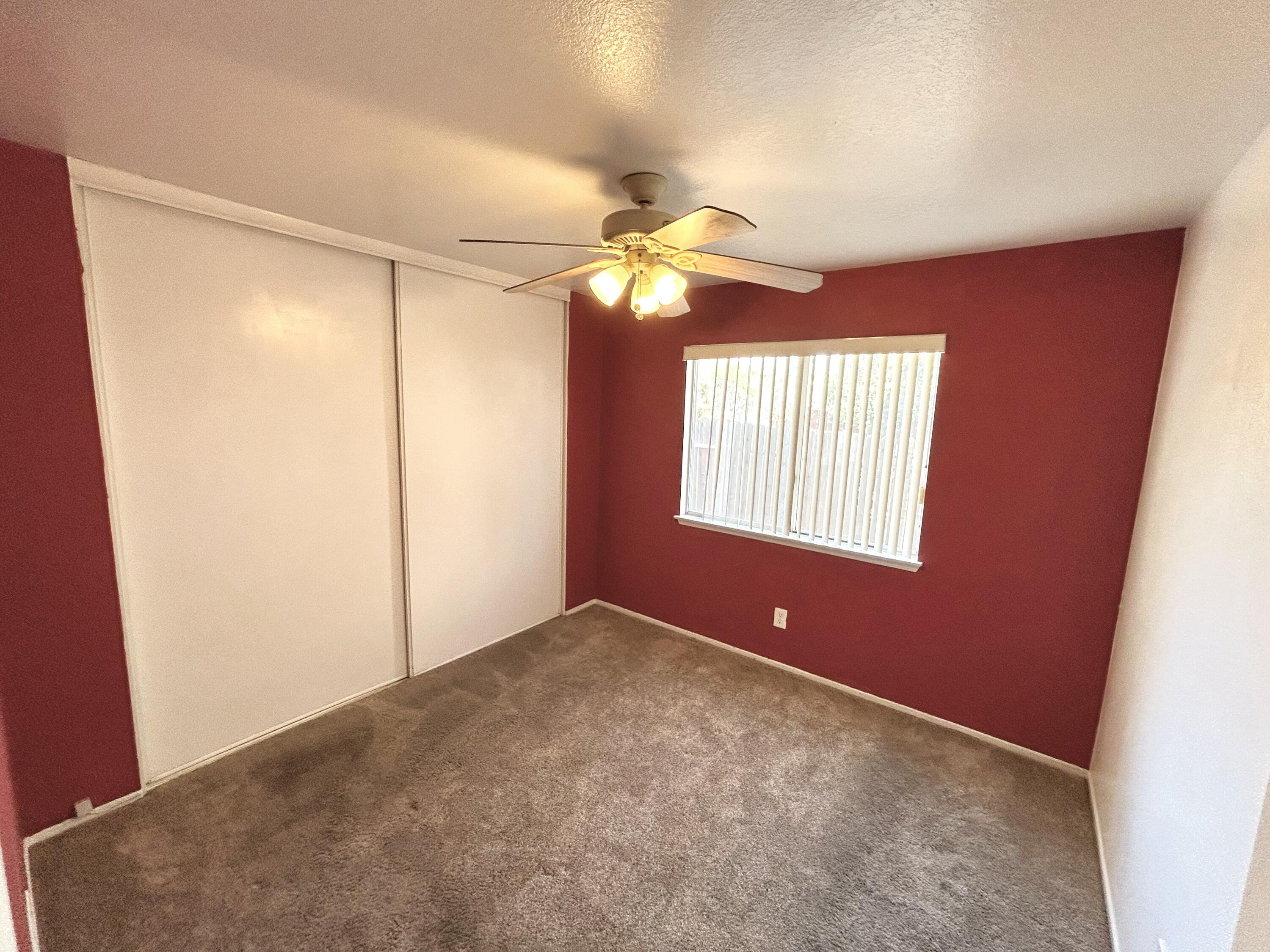 19940 Promenade Circle Riverside, CA 92508 - Photo 17 of 33 a view of an empty room with window and a kitchen