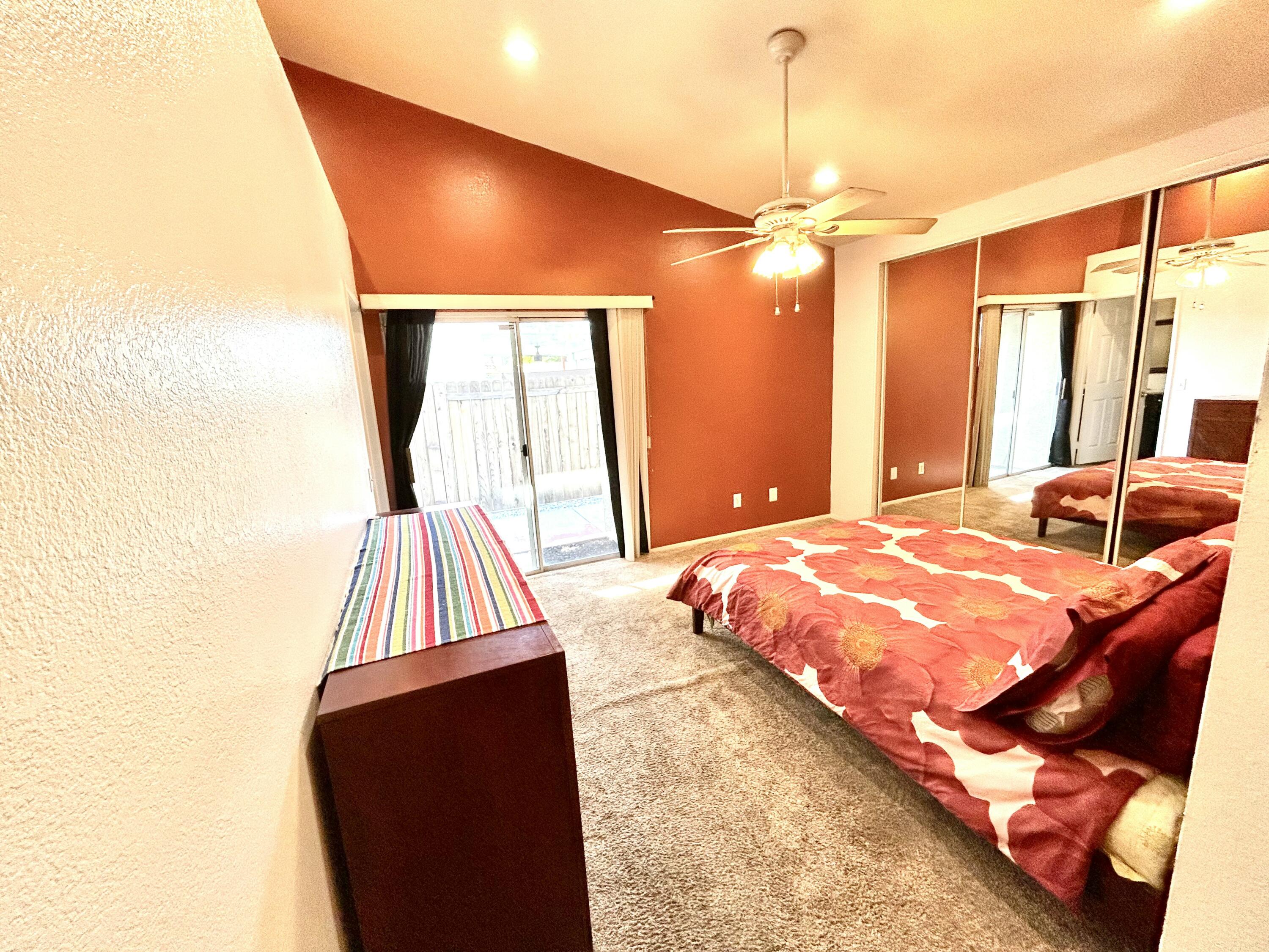 19940 Promenade Circle Riverside, CA 92508 - Photo 19 of 33 a bedroom with a bed and a chandelier