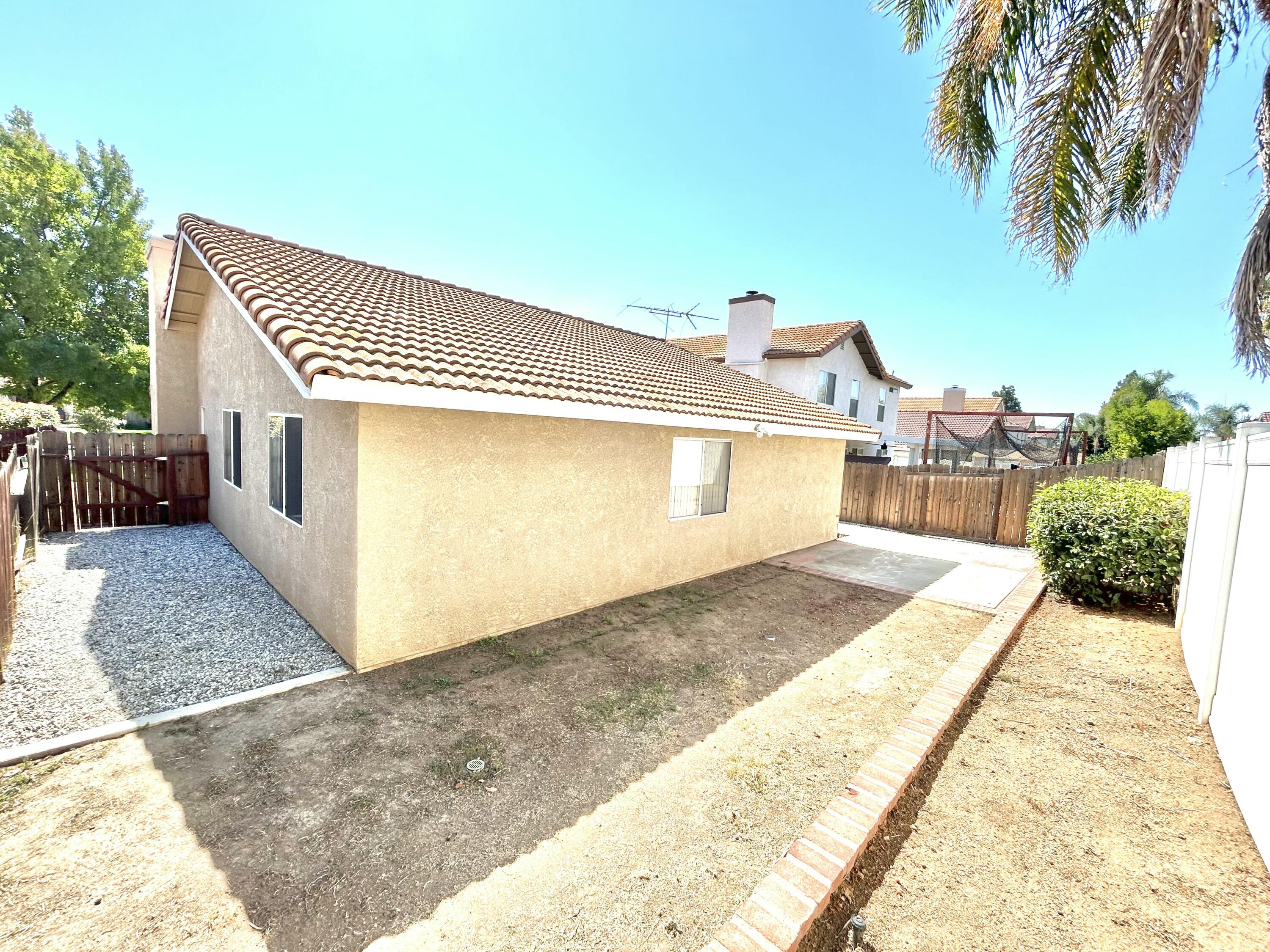 19940 Promenade Circle Riverside, CA 92508 - Photo 31 of 33 a front view of a house with a yard