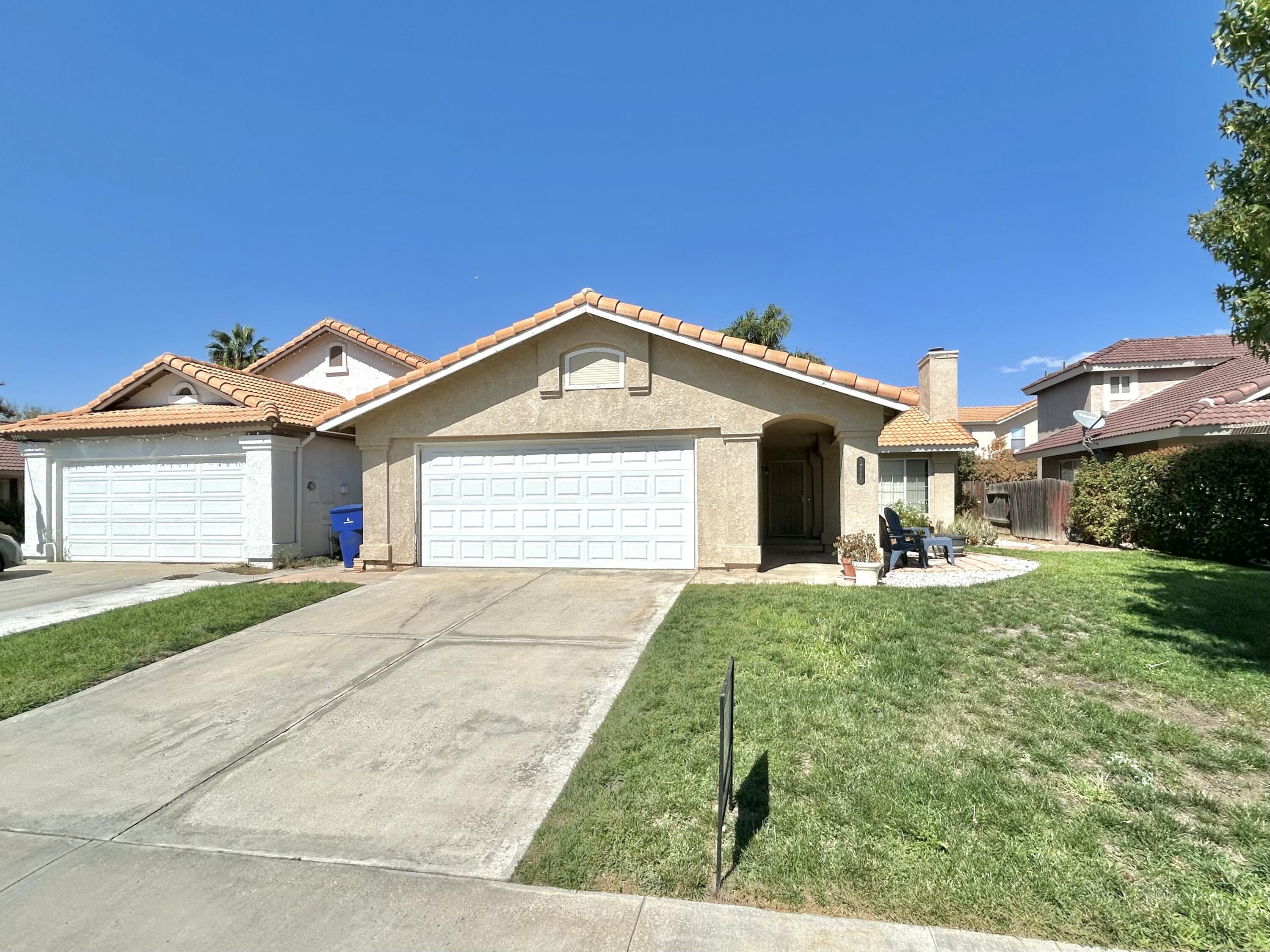 19940 Promenade Circle Riverside, CA 92508 - Photo 5 of 33 a front view of a house with a yard