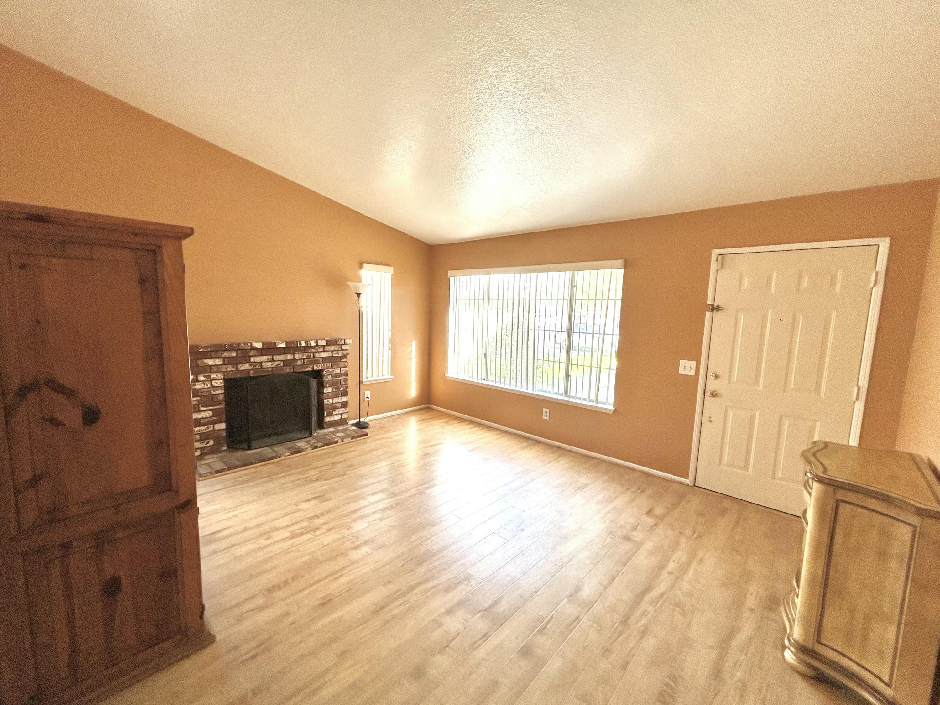 19940 Promenade Circle Riverside, CA 92508 - Photo 7 of 33 wooden floor in an empty room and a fireplace