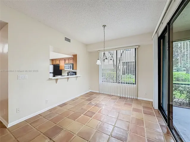 a view of outdoor space with wooden floor