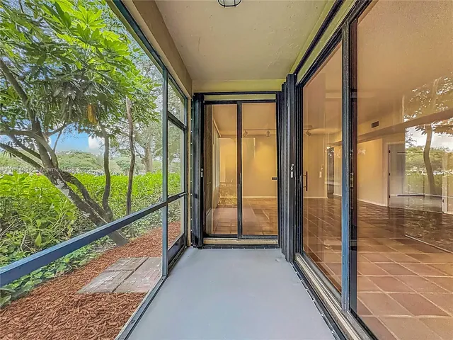a bathroom with a toilet a sink a mirror a bathtub and vanity