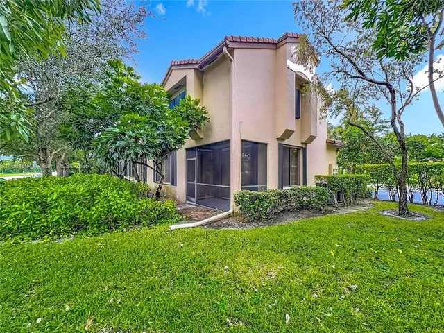 a white bath tub sitting next to a toilet