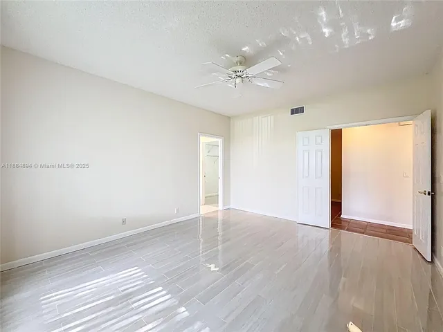 a view of a fountain in front of a house