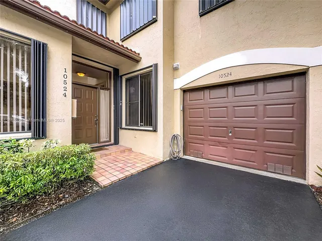 a view of a kitchen with a sink and a cabinet
