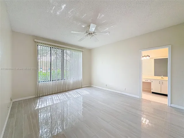 front view of a brick house with a yard