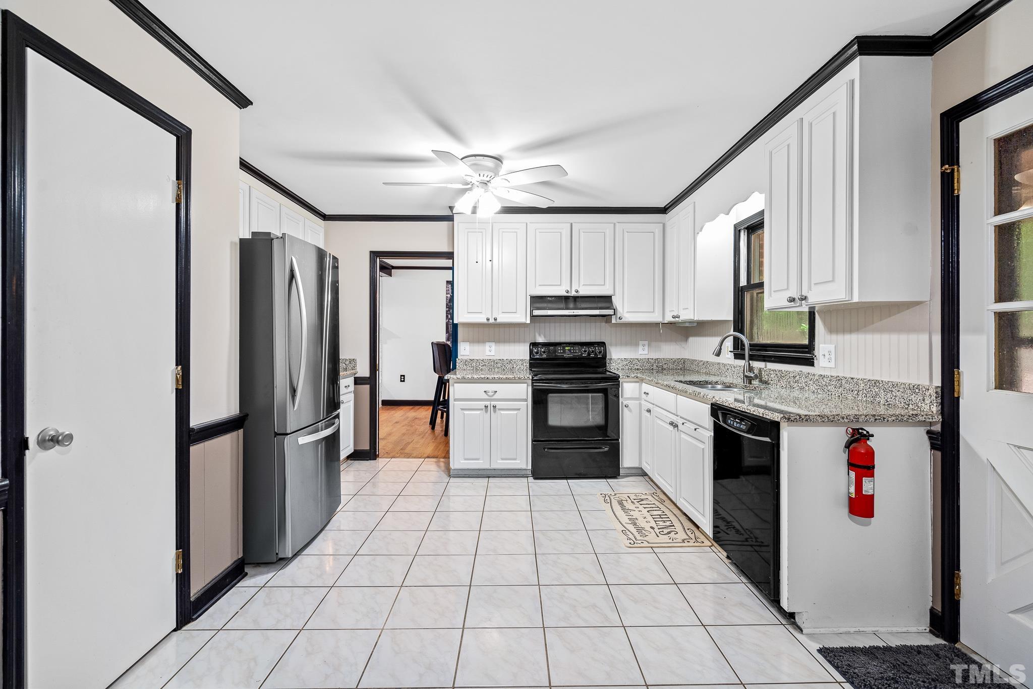 8808 Red Oak Court Raleigh, NC 27613 - Photo 25 of 34 a kitchen with stainless steel appliances granite countertop a refrigerator and a stove top oven