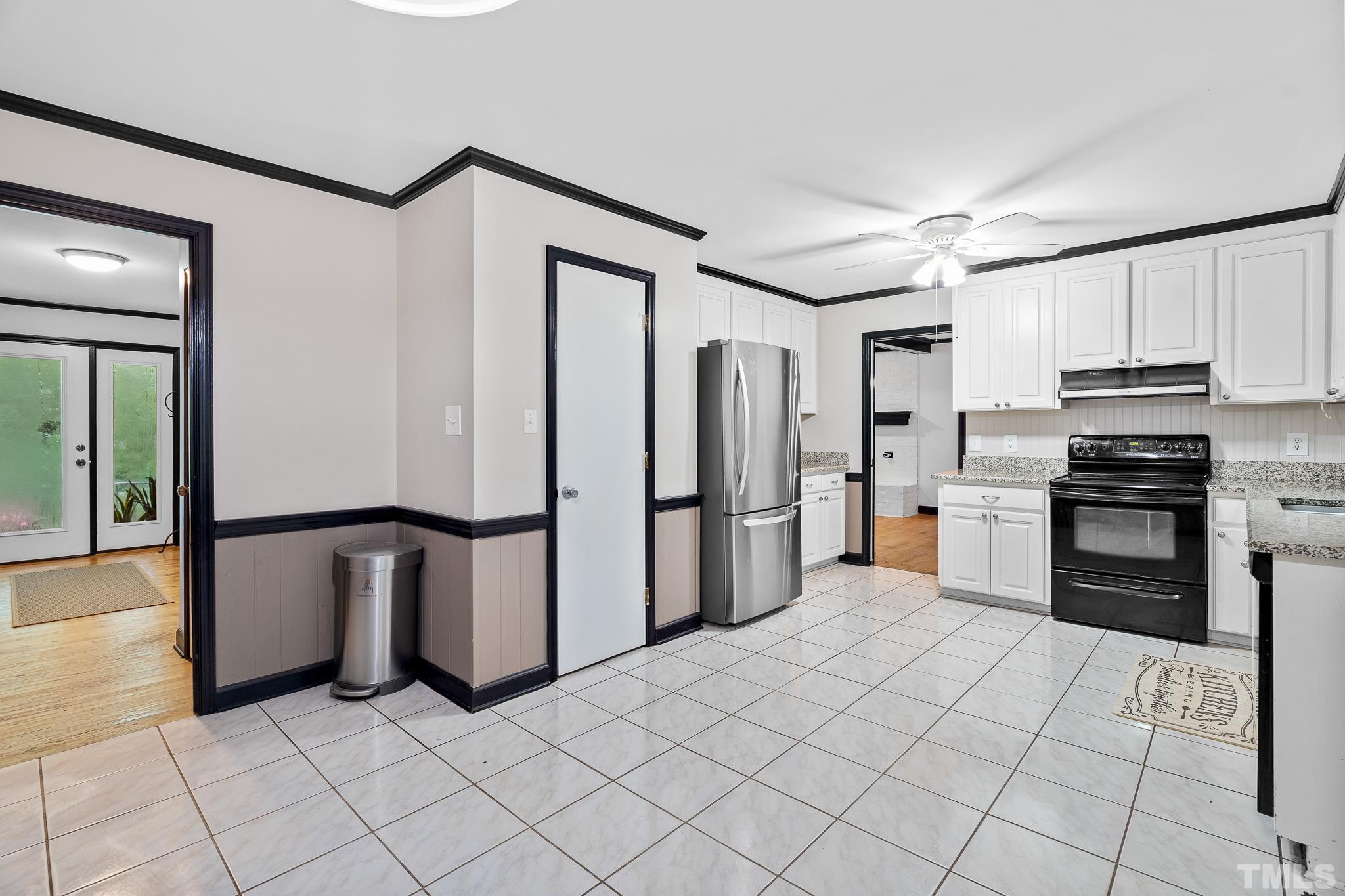 8808 Red Oak Court Raleigh, NC 27613 - Photo 27 of 34 a kitchen with stainless steel appliances a refrigerator sink and cabinets