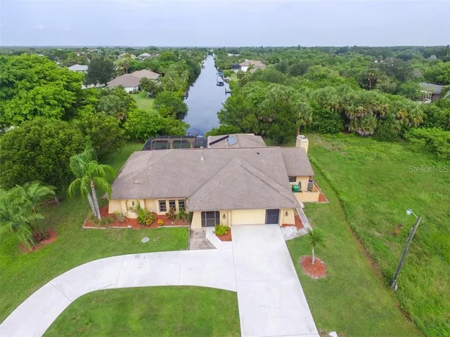 an aerial view of a house with a garden