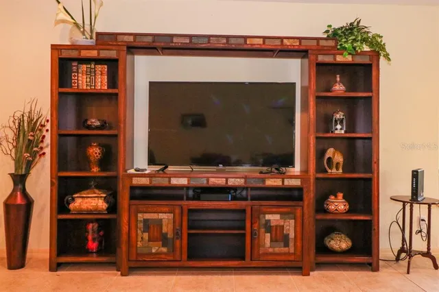 a kitchen with stainless steel appliances wooden cabinet and granite counter tops