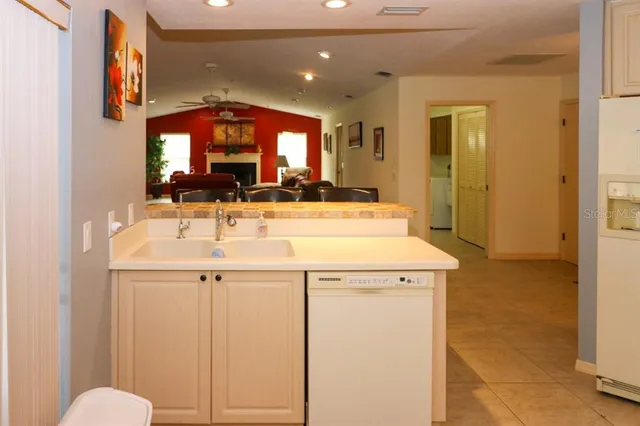 a room with a sink and a mirror