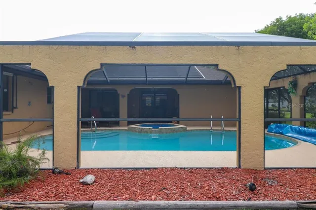 a view of balcony with wooden floor and fence