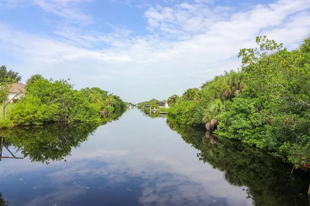 a view of a pathway with a yard