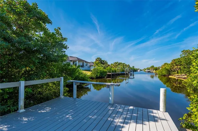 a view of a balcony with wooden floor