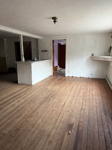 a view of a room with wooden floor and floors