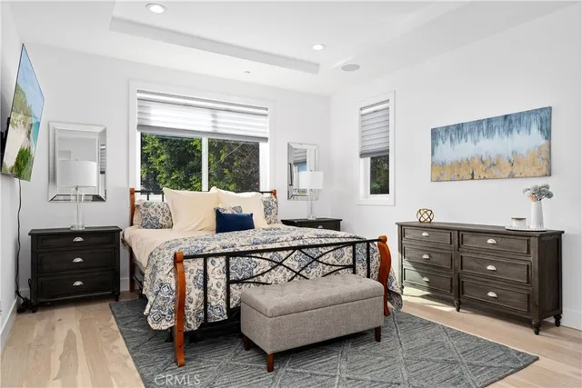 a living room with furniture and a dresser