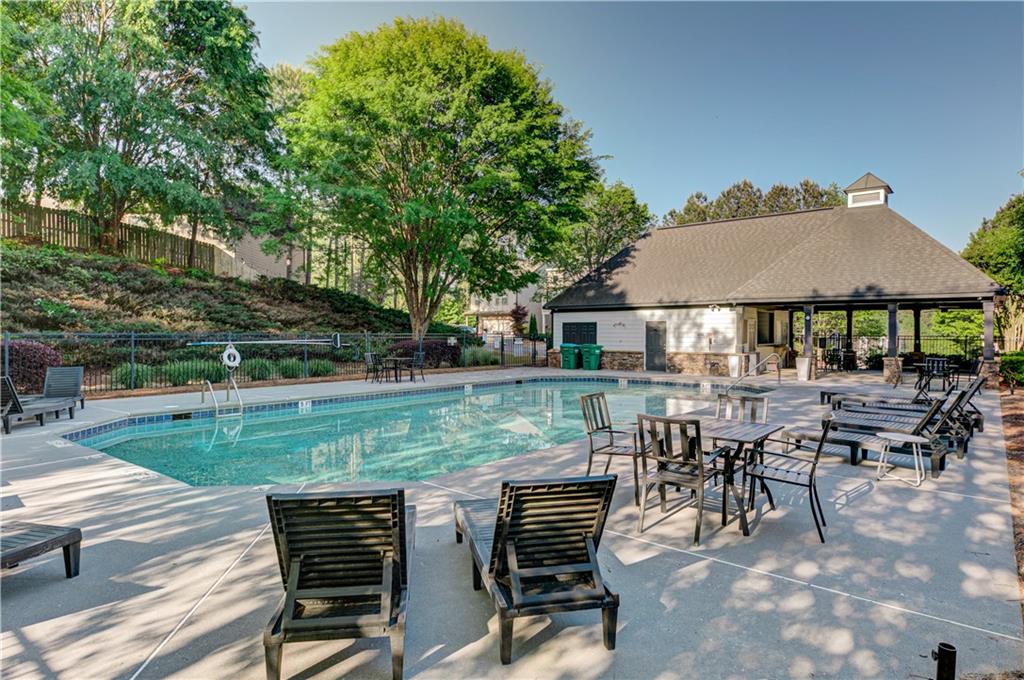 605 Summit Point Canton, GA 30114 - Photo 55 of 56 an outdoor space with patio and white umbrellas