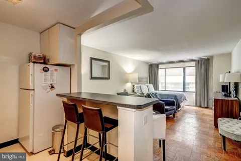 a view of a dining room with furniture and window