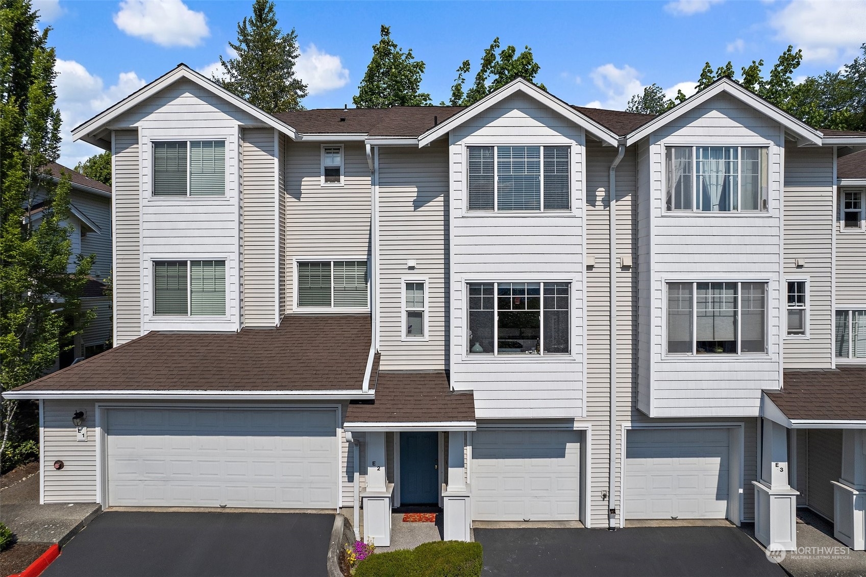 2300 Benson Road South, Unit E2 Renton, WA 98055 - Photo 1 of 35 a front view of a house with a yard