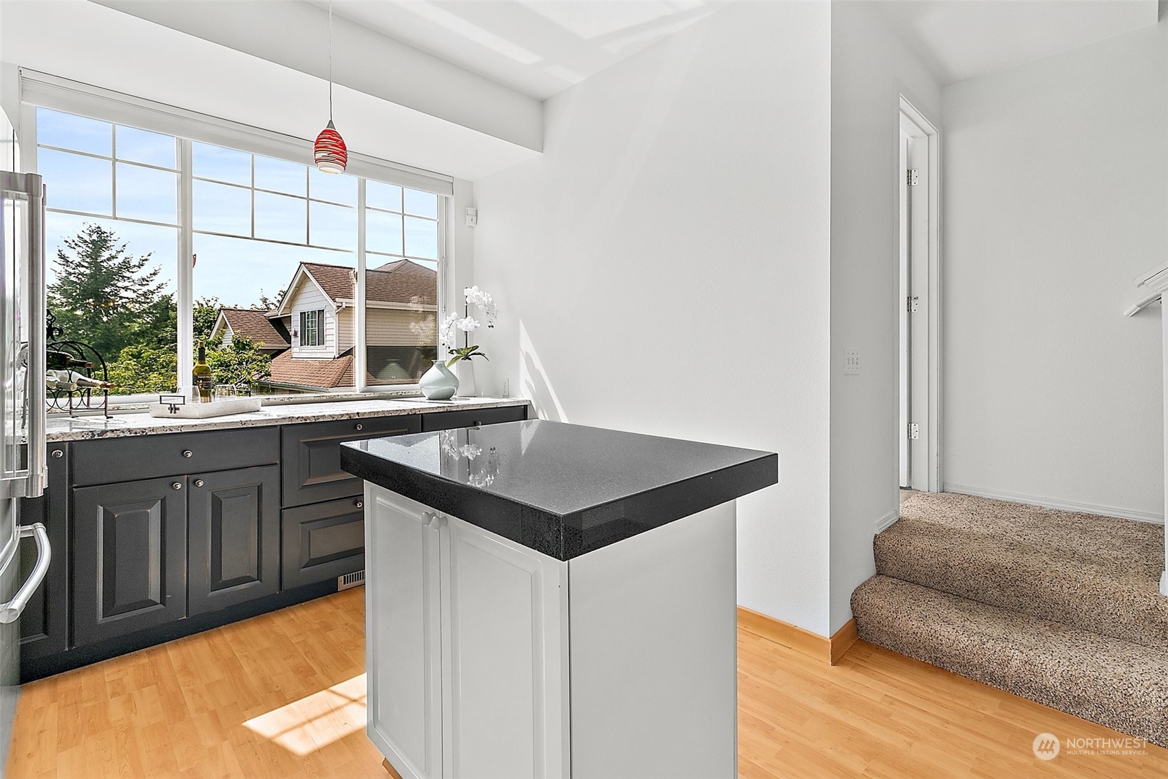 2300 Benson Road South, Unit E2 Renton, WA 98055 - Photo 18 of 35 a kitchen with a stove a sink and a window