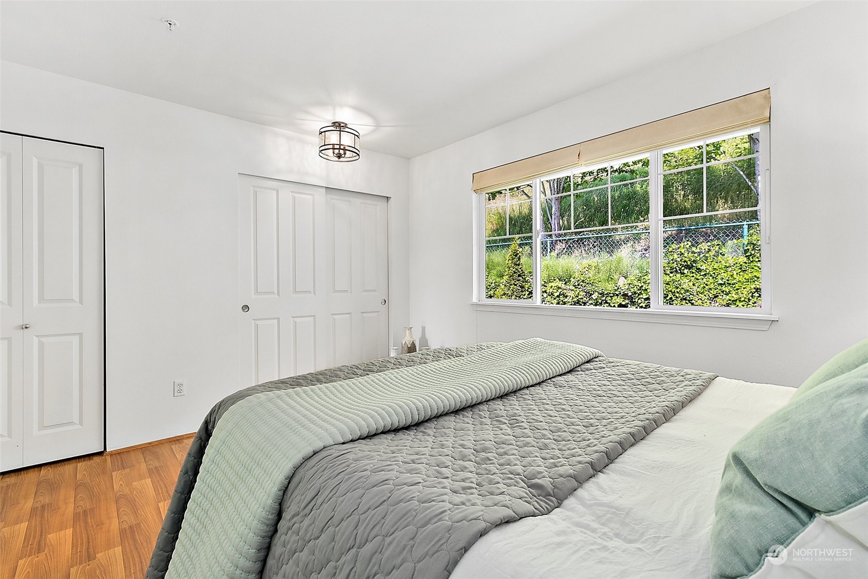 2300 Benson Road South, Unit E2 Renton, WA 98055 - Photo 21 of 35 a bedroom with a bed and a window