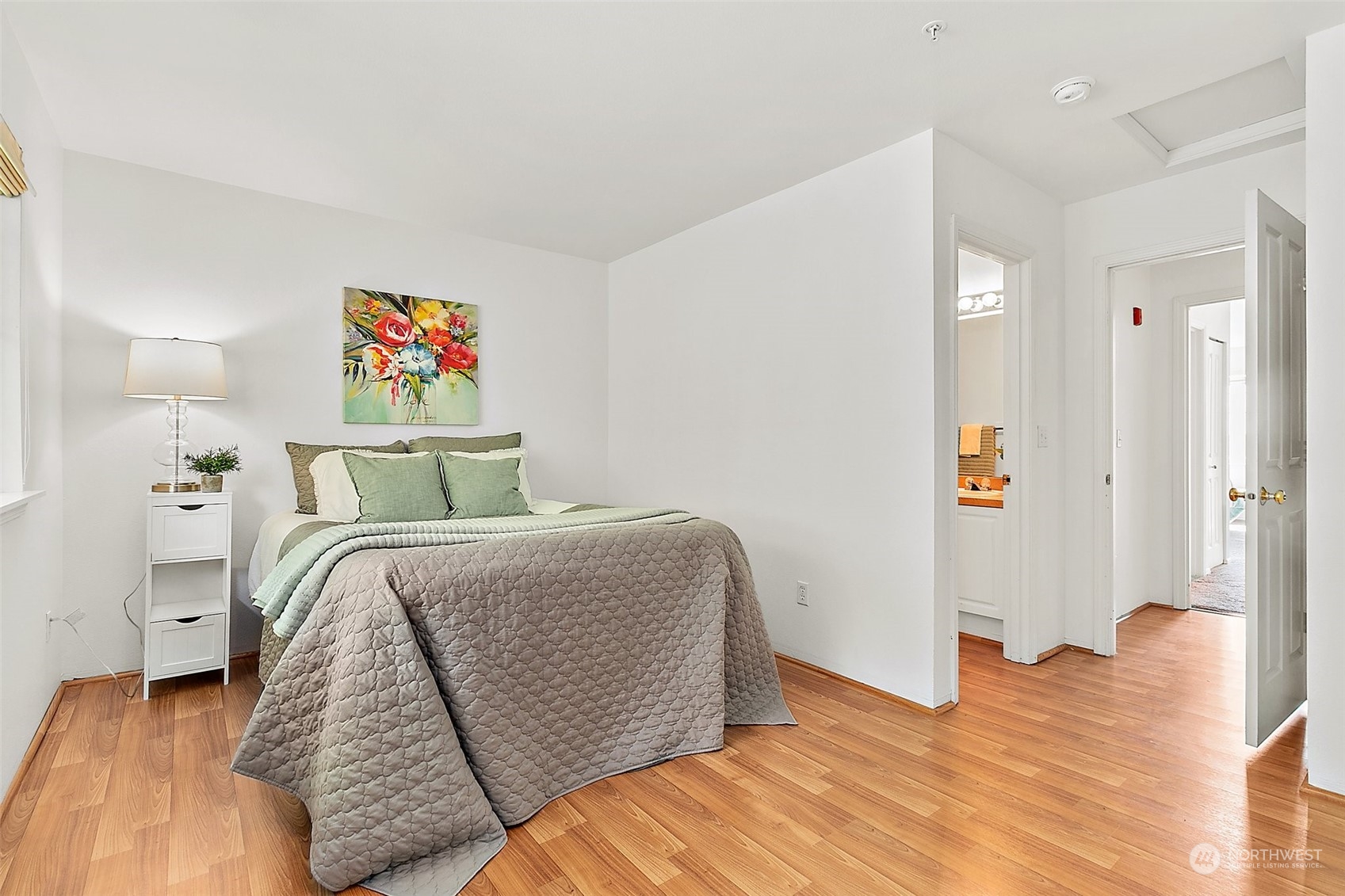 2300 Benson Road South, Unit E2 Renton, WA 98055 - Photo 22 of 35 a bedroom with a bed and painting on the wall