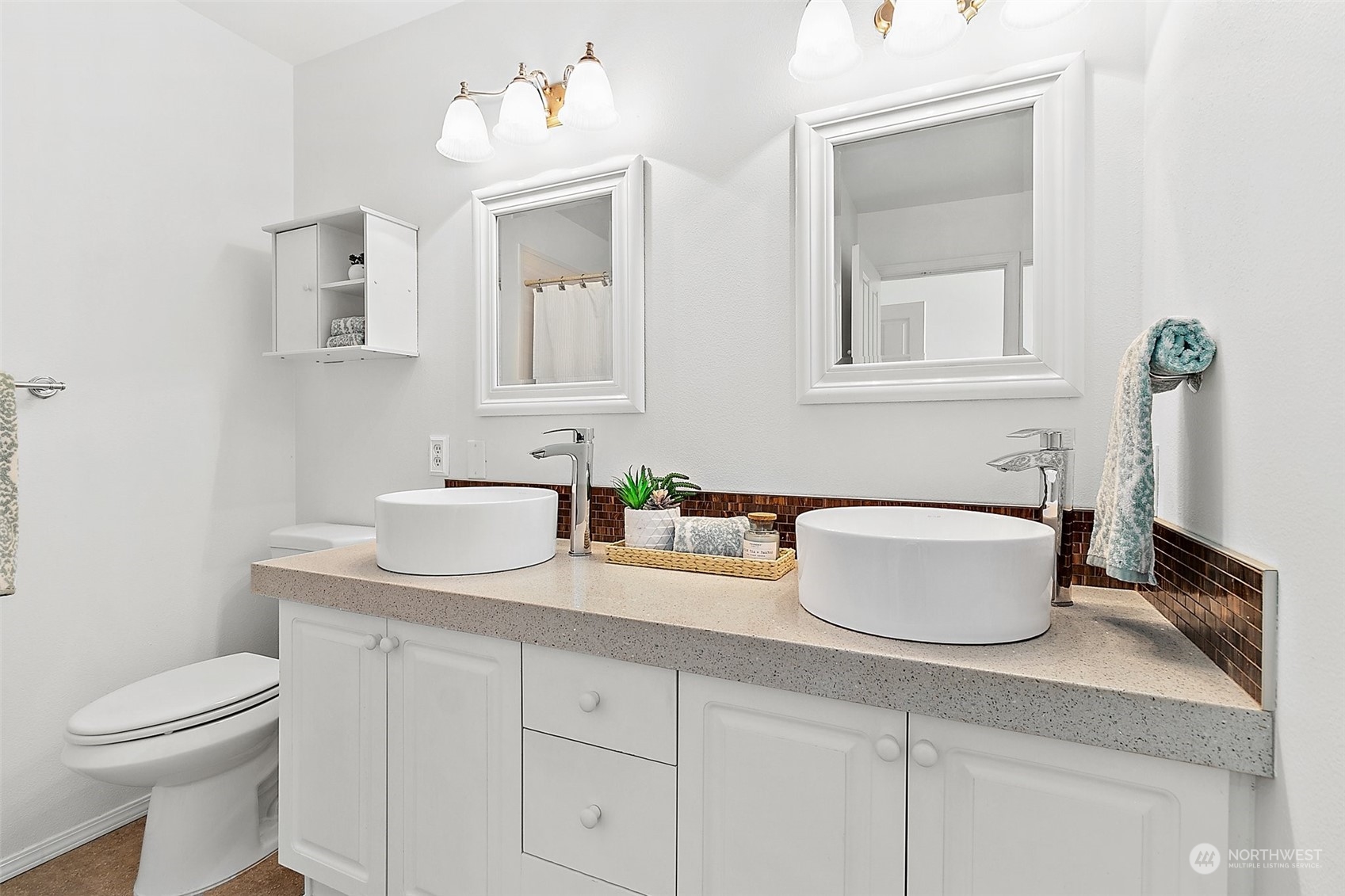 2300 Benson Road South, Unit E2 Renton, WA 98055 - Photo 23 of 35 a bathroom with a toilet a sink and mirror