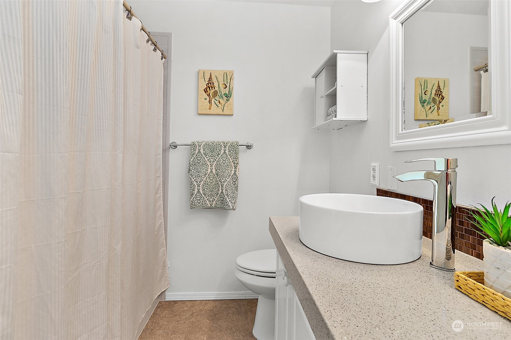 2300 Benson Road South, Unit E2 Renton, WA 98055 - Photo 24 of 35 a bathroom with a toilet a sink and mirror