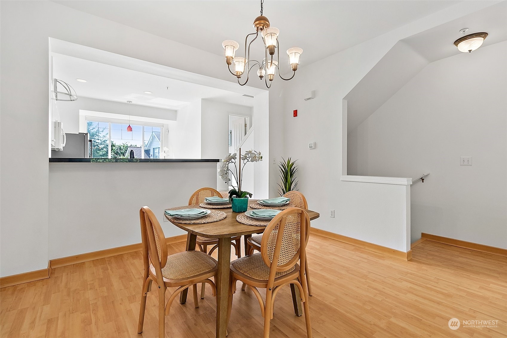 2300 Benson Road South, Unit E2 Renton, WA 98055 - Photo 4 of 35 a view of a dining room with furniture and wooden floor