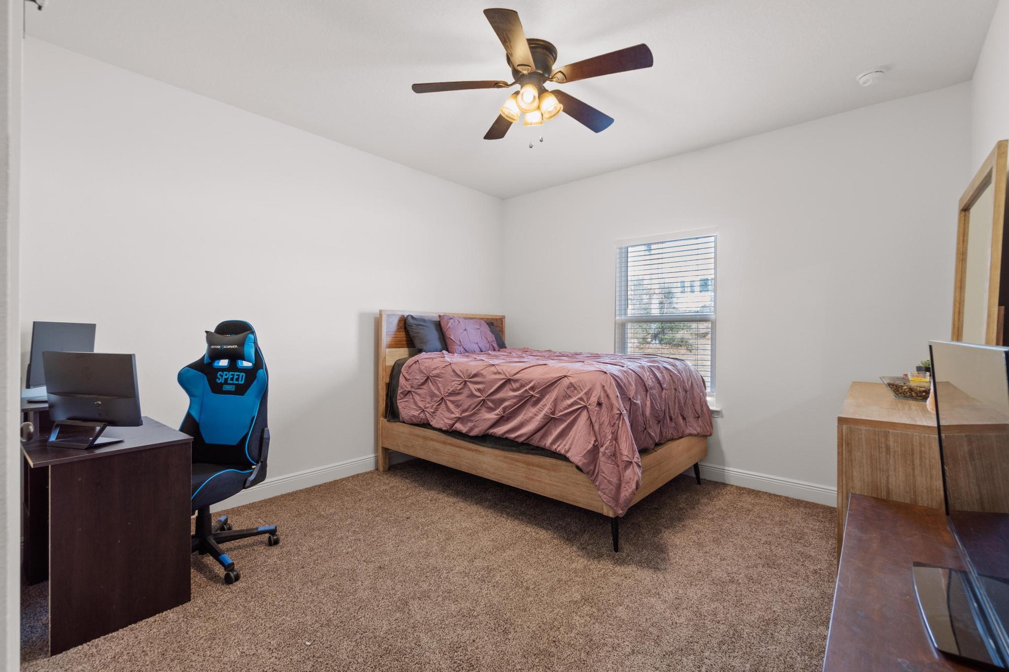 3586 Randy Drive Crestview, FL 32539 - Photo 30 of 42 a bedroom with a bed and a desk