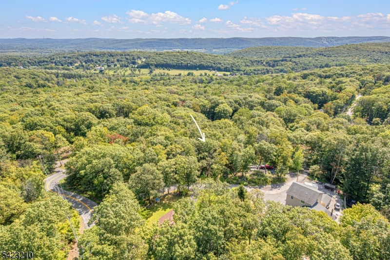 7 Split Rock Lane Vernon, NJ 07461 - Photo 5 of 8 a view of a city with lush green forest
