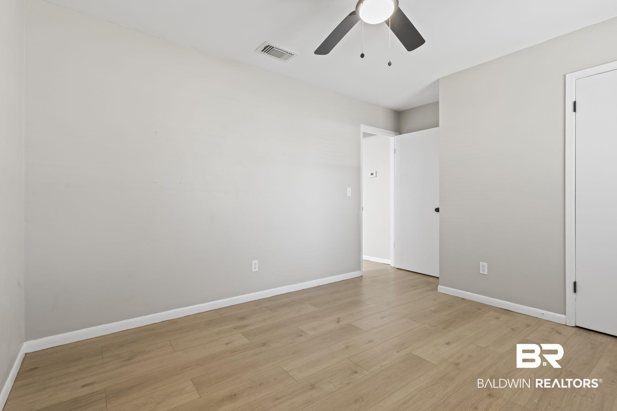309 West Roosevelt Avenue Foley, AL 36535 - Photo 18 of 60 Unfurnished room featuring ceiling fan and light hardwood / wood-style floors