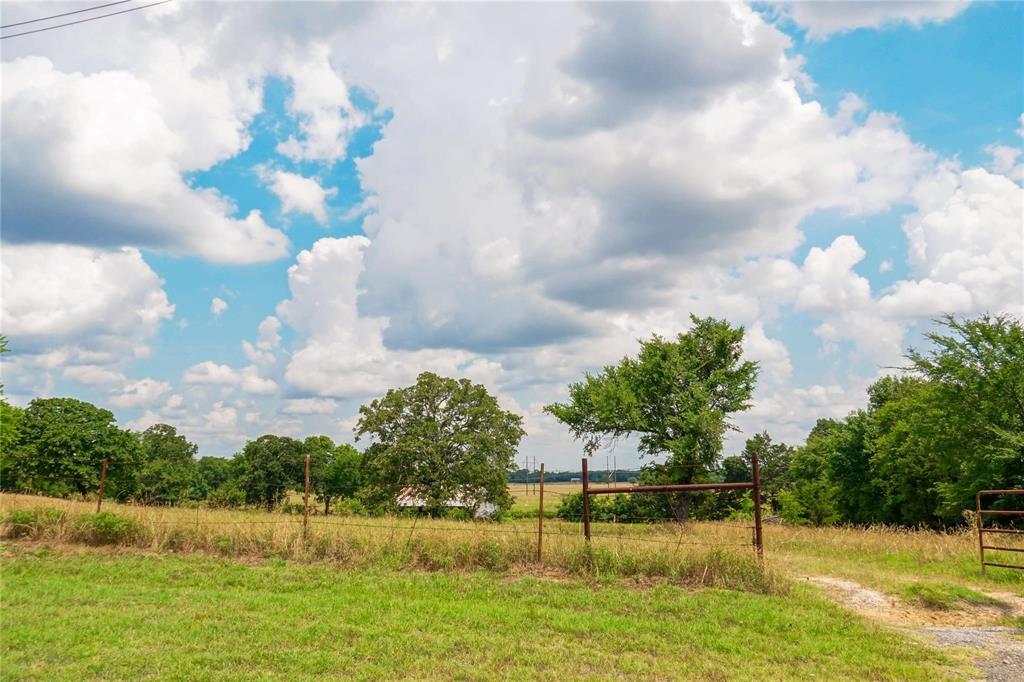 7527 Highway 1753 Denison, TX 75021 - Photo 8 of 10 a view of a lake with houses in the background