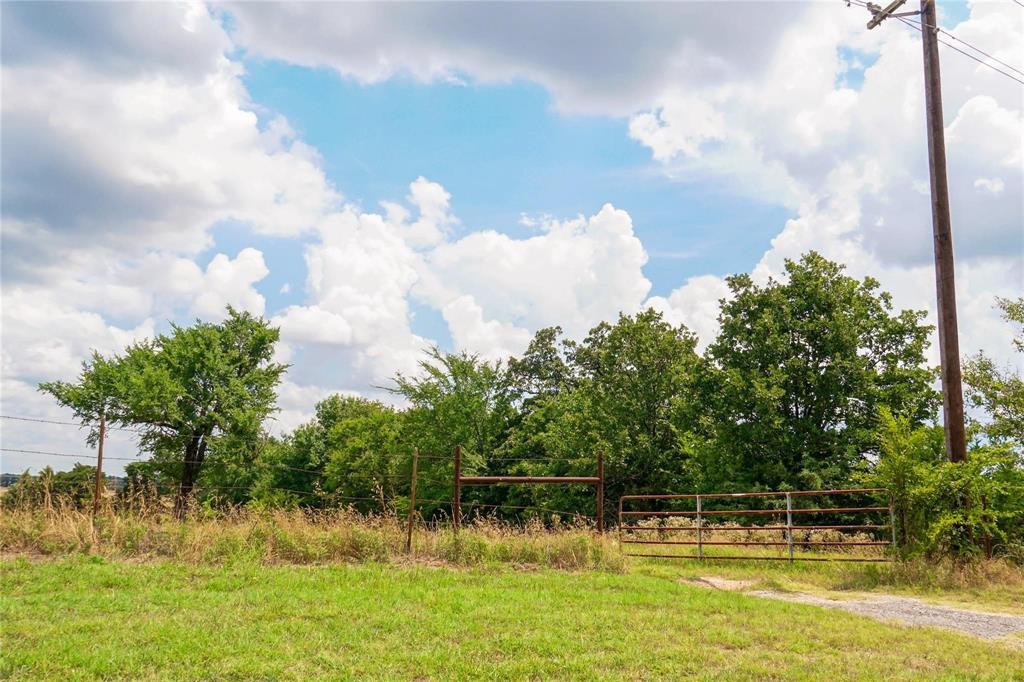 7527 Highway 1753 Denison, TX 75021 - Photo 9 of 10 a view of swimming pool with a yard