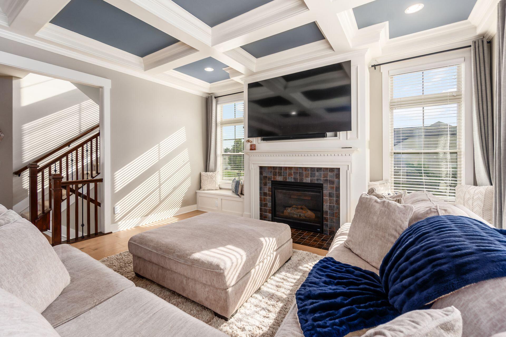 1002 Rambling Brook Way Delaware, OH 43015 - Photo 15 of 104 Spacious Great Room with coffered ceiling, window benches and gas fireplace