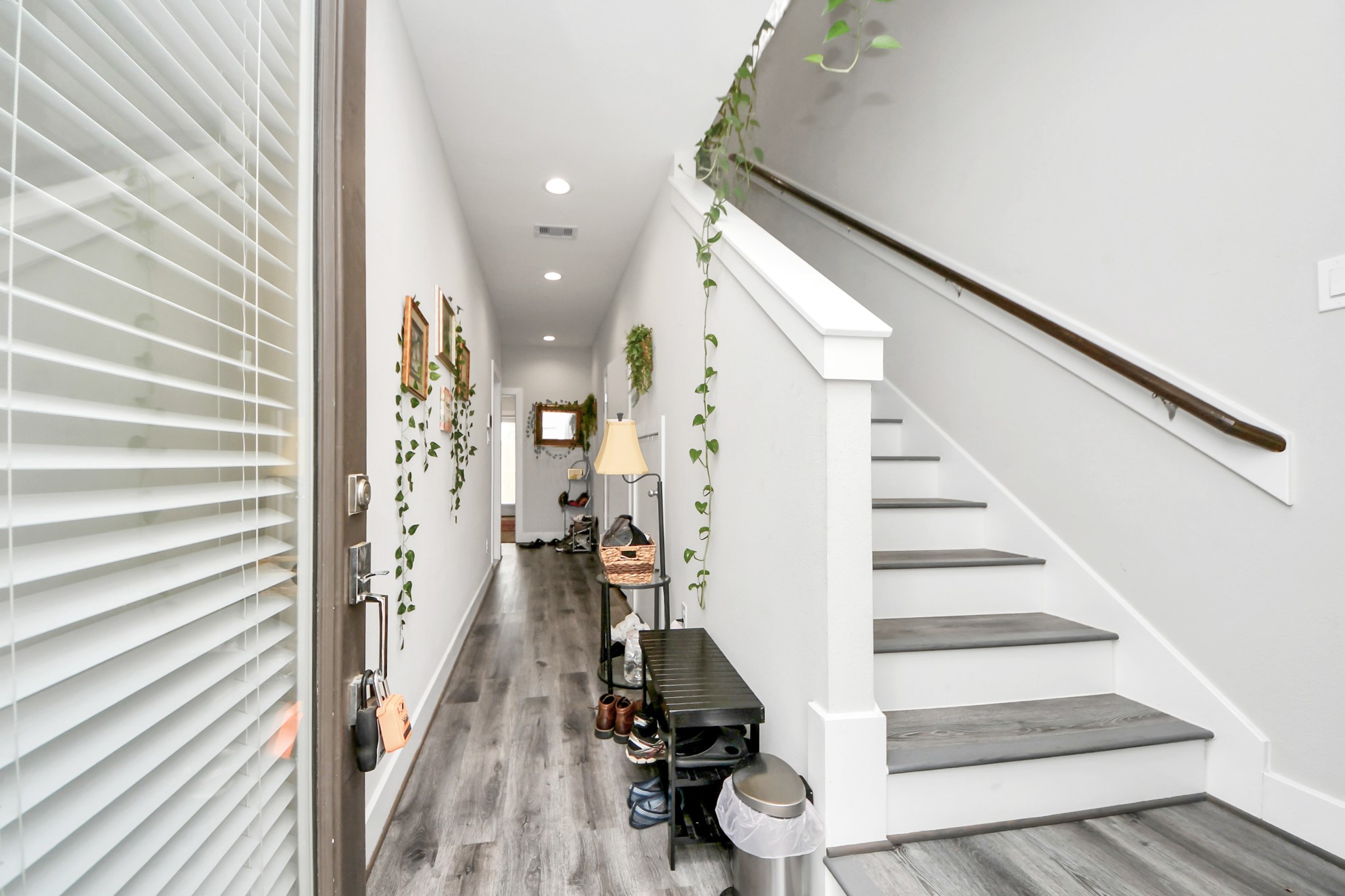 6715 Allegheny Street Houston, TX 77021 - Photo 3 of 18 a view of entryway with wooden floor and stairs