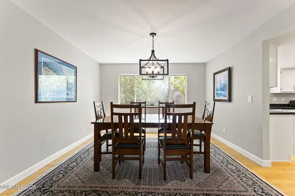 a view of a dining room with furniture window and wooden floor