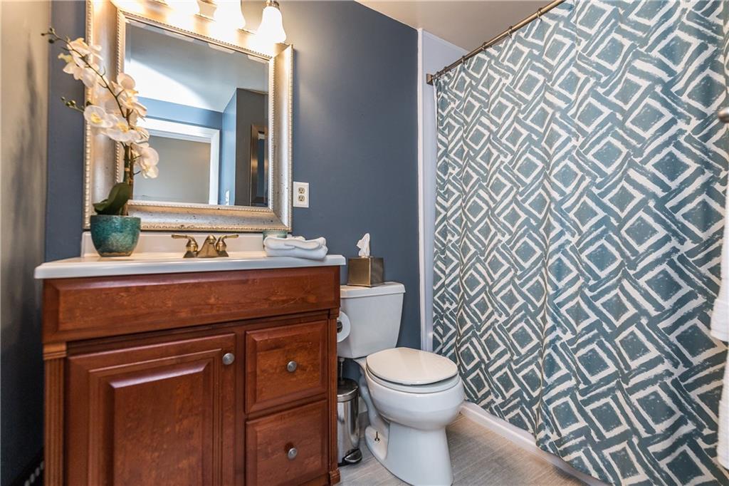 205 Wyngate Road Coraopolis, PA 15108 - Photo 15 of 25 Updated guest bath, with new flooring, lighting and vanity, conveniently located.