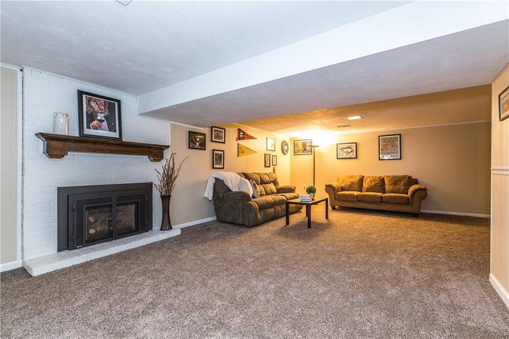 205 Wyngate Road Coraopolis, PA 15108 - Photo 16 of 25 Spacious family room, with newly installed gas fireplace, and new carpeting. Perfect setting for entertaining and Steeler Sundays!